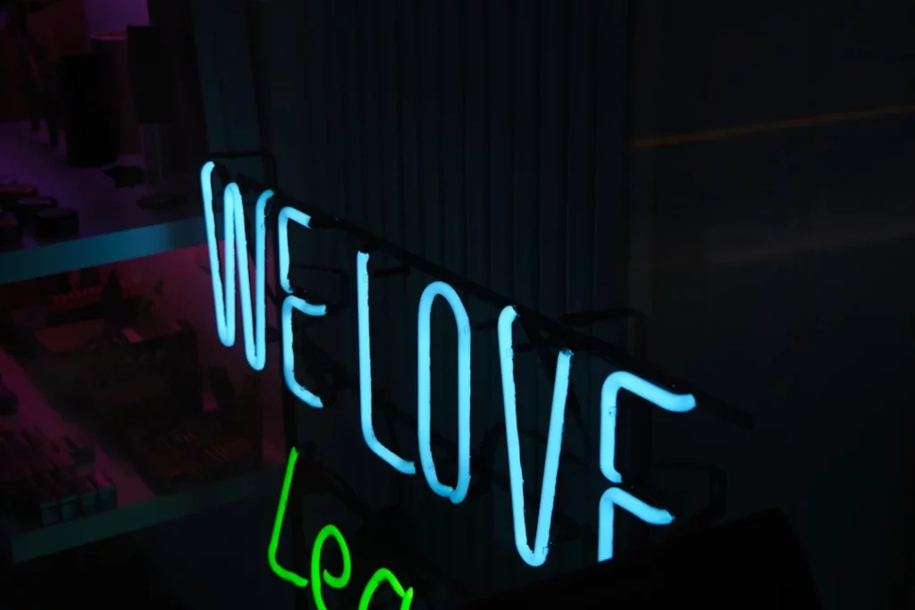 blue and white open neon light signage