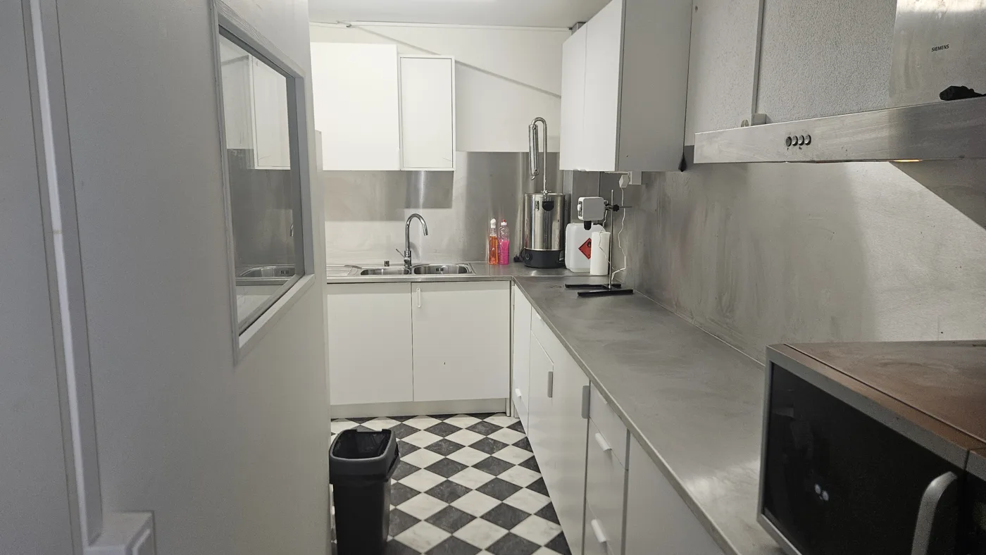 Stainless steel benches and splashbacks in The Green Lab laboratory in Gland
