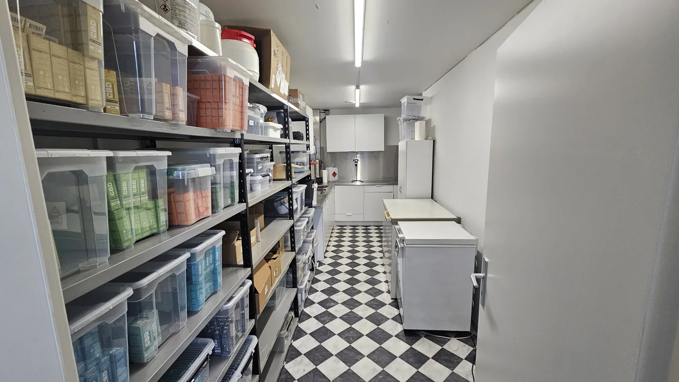 Store room for raw materials and packaging, shelves of storage boxes